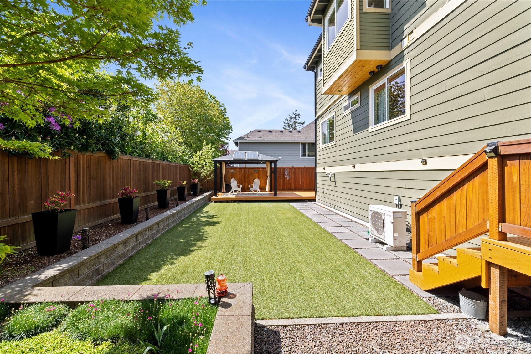 1409 Shattuck Avenue South Renton, WA 98055 - Photo 31 of 37 a view of a house with backyard and sitting area