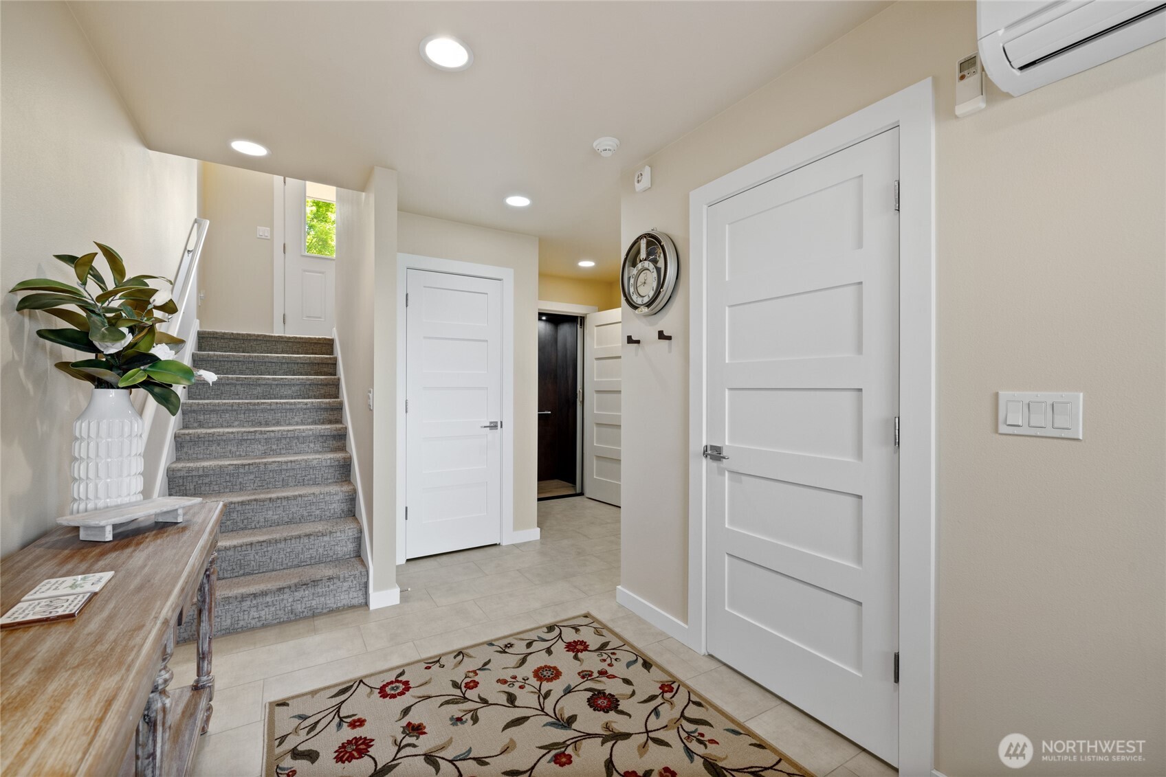 1409 Shattuck Avenue South Renton, WA 98055 - Photo 4 of 37 a hallway with wooden floor and a potted plant