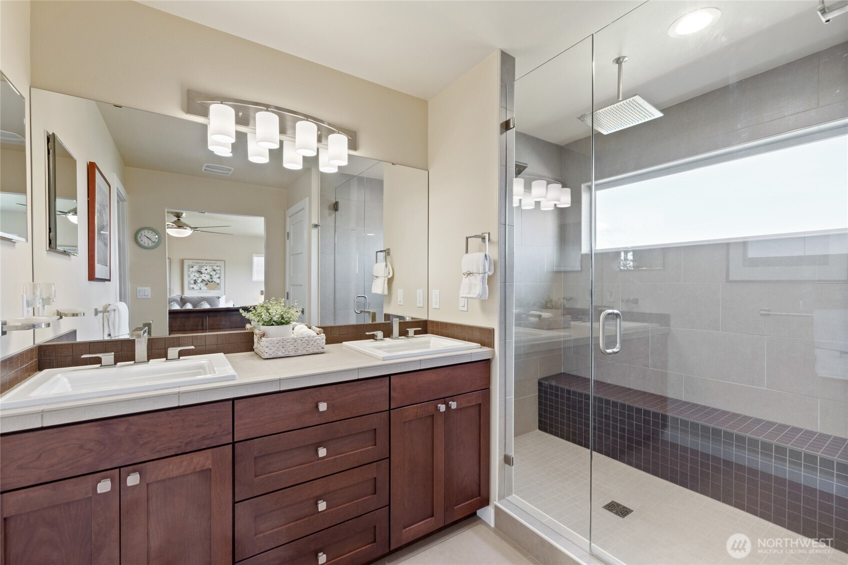 1409 Shattuck Avenue South Renton, WA 98055 - Photo 7 of 37 a bath room with a sink double vanity granite tub shower and a mirror