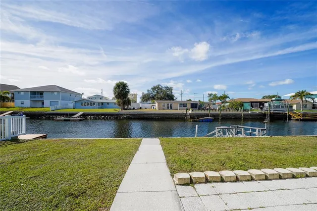 a view of a house with backyard porch and sitting area