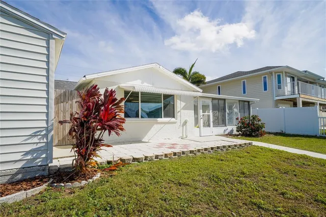 a spacious bedroom with a bed a couch and dresser