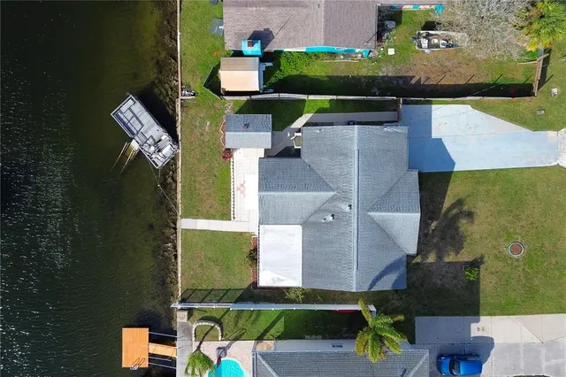 an aerial view of a house with outdoor space