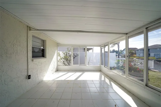 a view of an empty room with windows