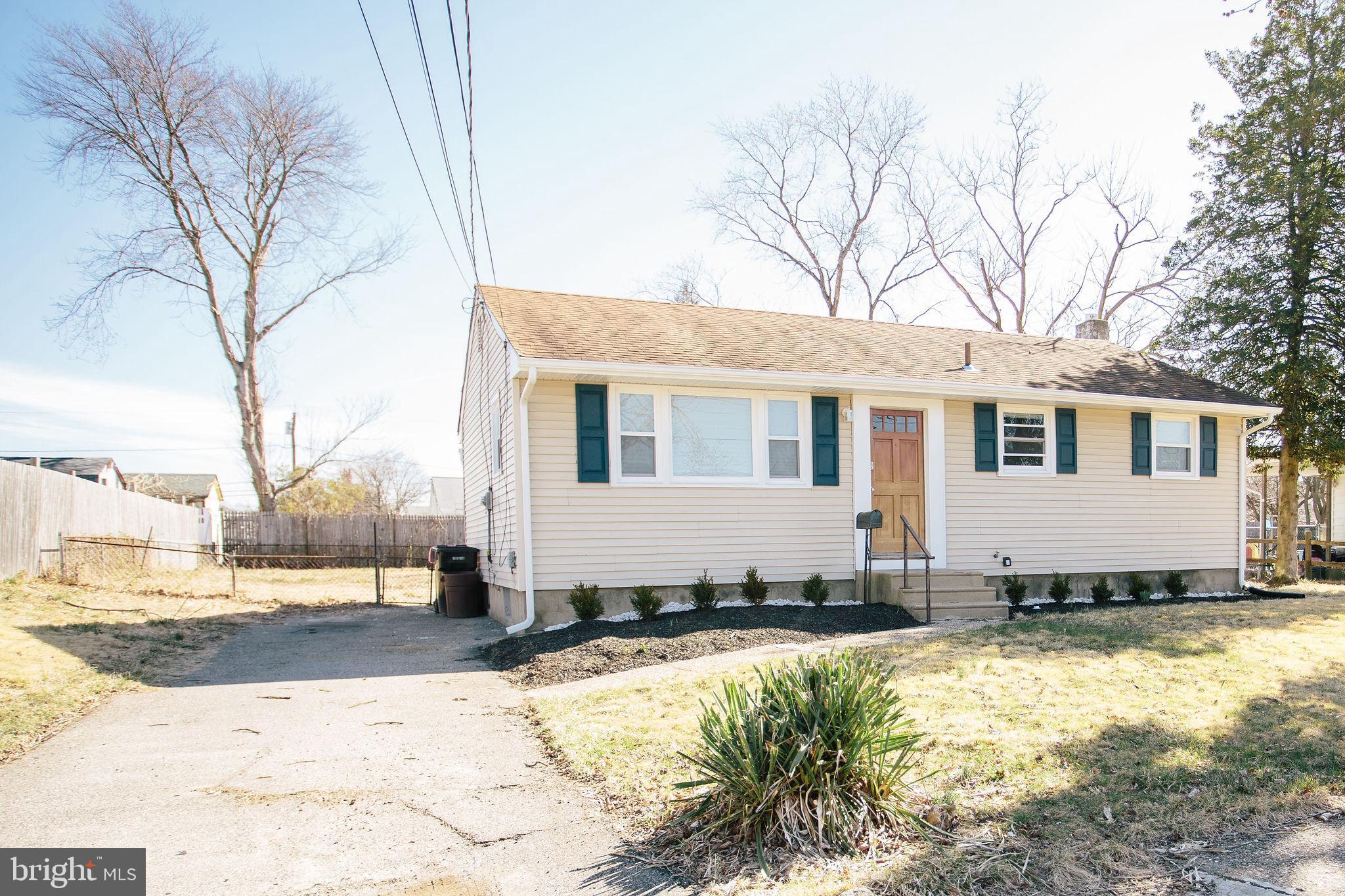 119 Trinity Avenue Blackwood, NJ 08012 - Photo 2 of 37 a view of a white house with a yard covered in snow