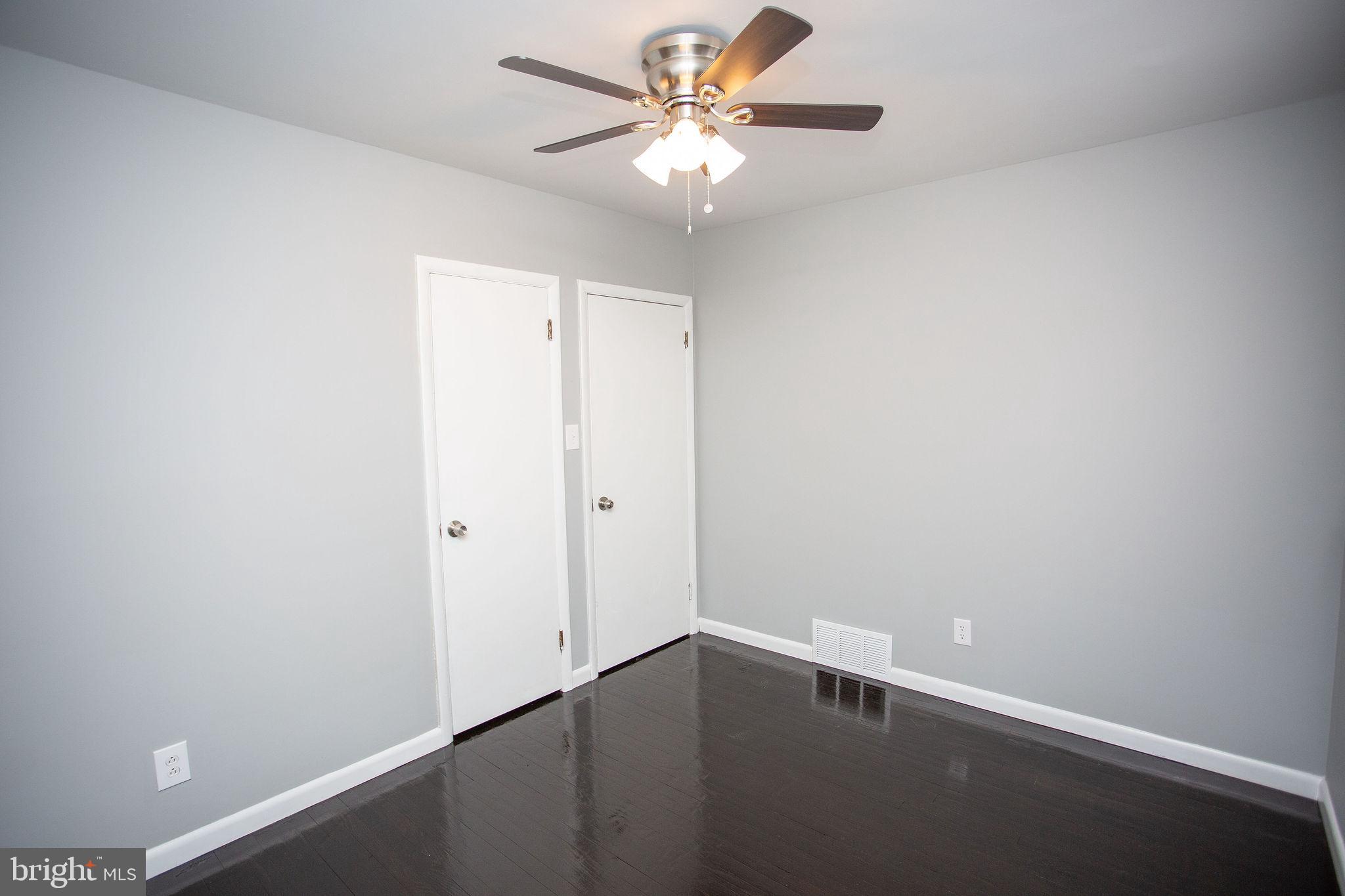 119 Trinity Avenue Blackwood, NJ 08012 - Photo 23 of 37 an empty room with a ceiling fan and a window