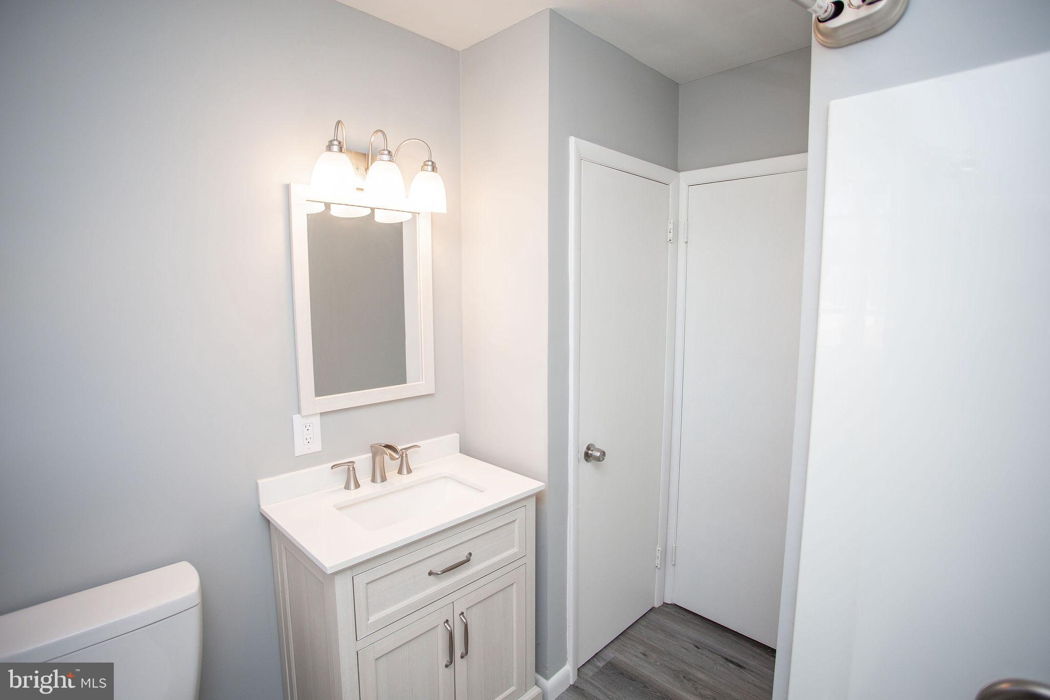 119 Trinity Avenue Blackwood, NJ 08012 - Photo 25 of 37 a bathroom with a sink and a mirror