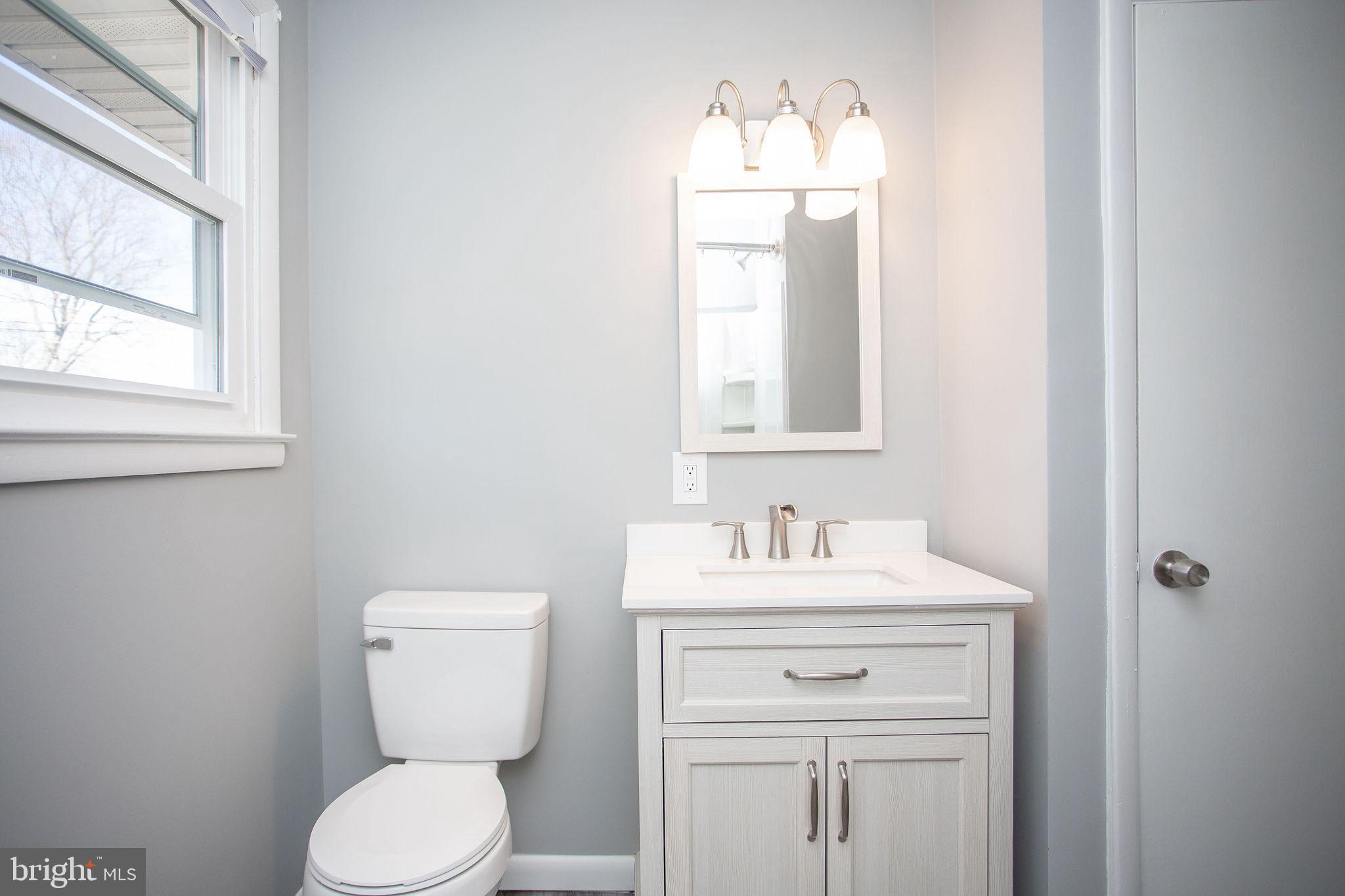 119 Trinity Avenue Blackwood, NJ 08012 - Photo 26 of 37 a bathroom with a toilet sink and mirror