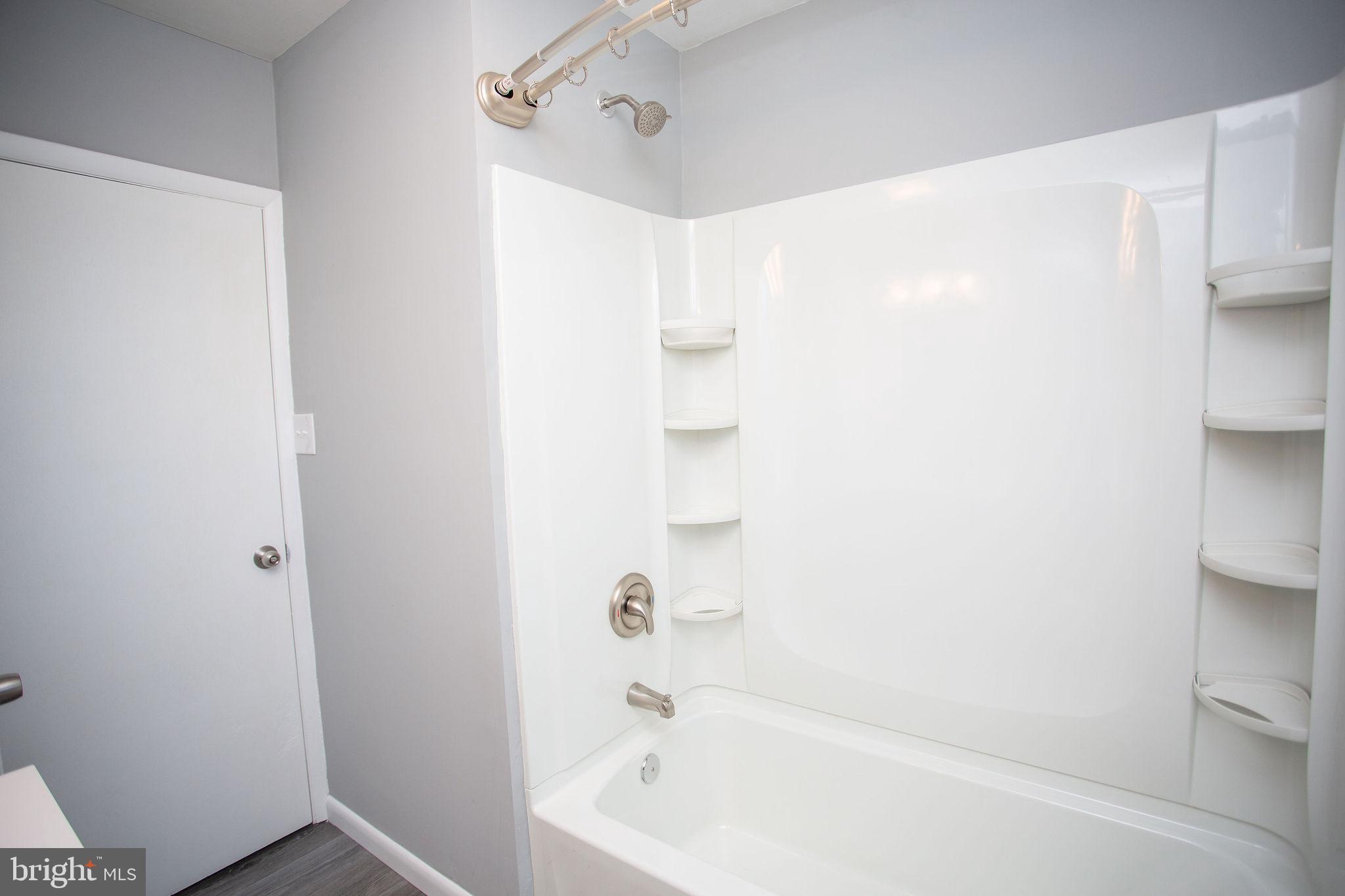 119 Trinity Avenue Blackwood, NJ 08012 - Photo 27 of 37 a bathroom with a bathtub and a shower