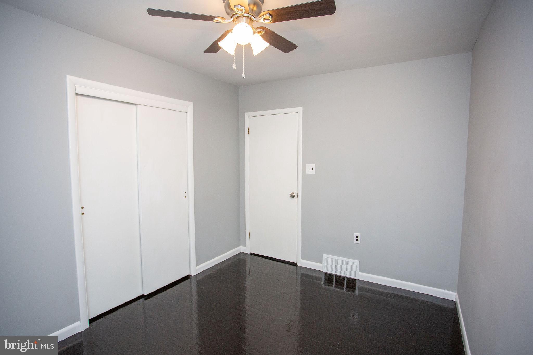 119 Trinity Avenue Blackwood, NJ 08012 - Photo 29 of 37 an empty room with a window and a fan