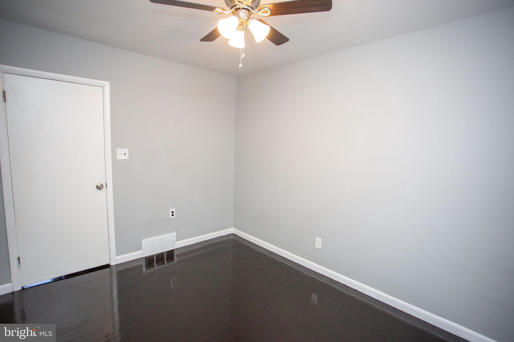 119 Trinity Avenue Blackwood, NJ 08012 - Photo 30 of 37 an empty room with a ceiling fan and carpet