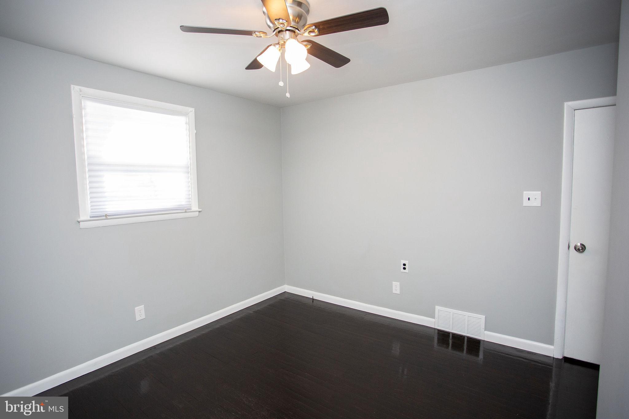 119 Trinity Avenue Blackwood, NJ 08012 - Photo 32 of 37 an empty room with a window and a fan