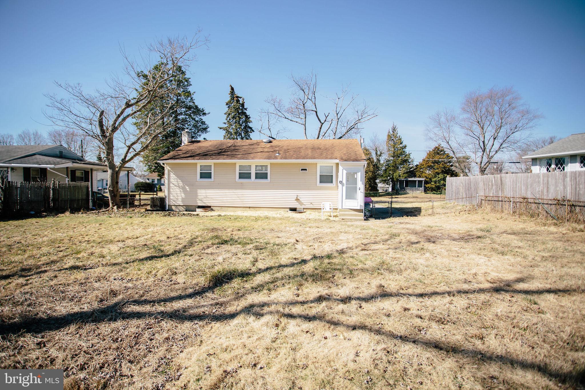 119 Trinity Avenue Blackwood, NJ 08012 - Photo 36 of 37 a view of large house with a yard covered in snow