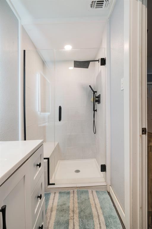 1070 Cardinal Lane Paris, TX 75460 - Photo 11 of 20 a bathroom with a tub shower and sink