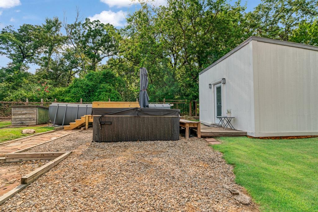 1070 Cardinal Lane Paris, TX 75460 - Photo 14 of 20 a view of backyard with barbeque grill and wooden fence