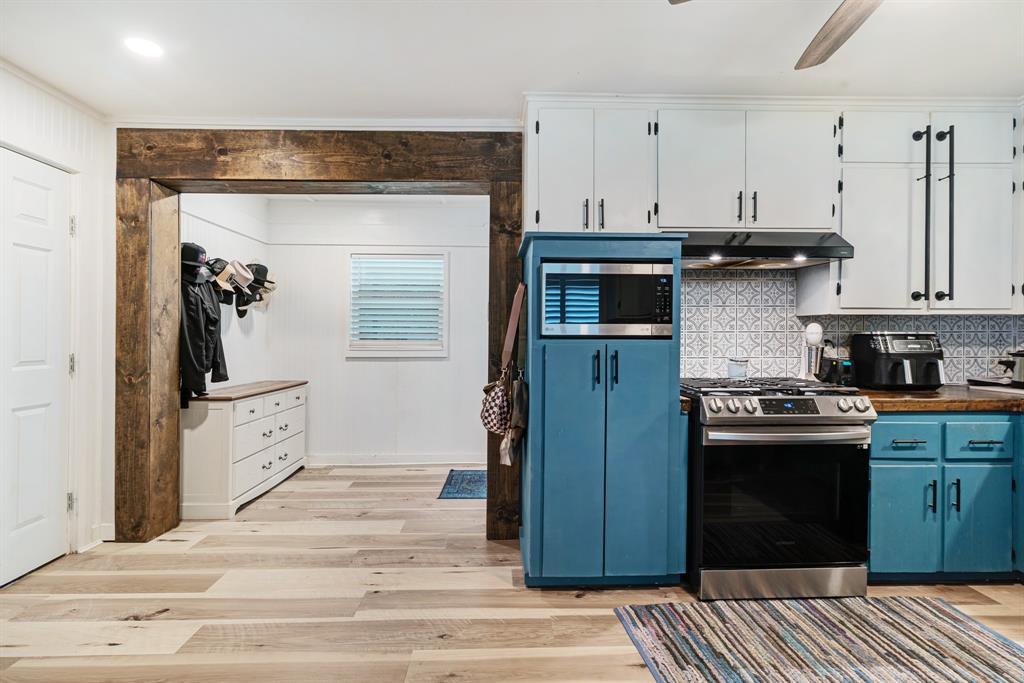 1070 Cardinal Lane Paris, TX 75460 - Photo 6 of 20 a kitchen with stainless steel appliances granite countertop a stove and a refrigerator