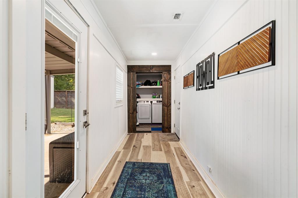 1070 Cardinal Lane Paris, TX 75460 - Photo 7 of 20 a view of a hallway view with wooden floor and staircase