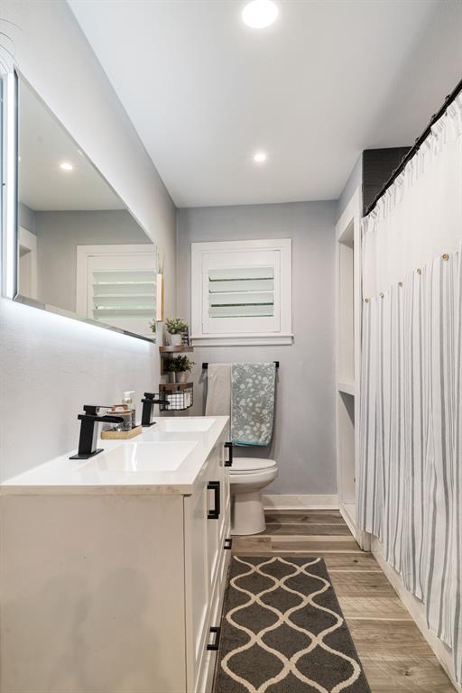 1070 Cardinal Lane Paris, TX 75460 - Photo 9 of 20 a bathroom with a sink toilet and shower