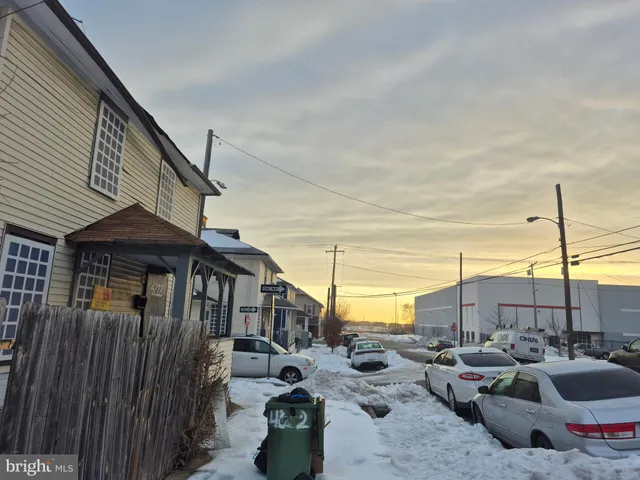a view of roof deck with couches and wooden floor