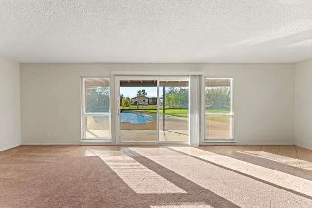 a view of a livingroom with wooden floor