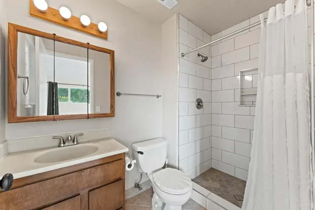 a utility room with cabinets washer and dryer