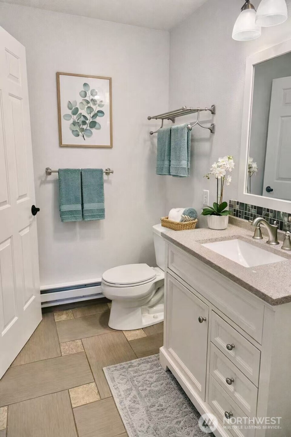 927 132nd Street Southwest, Unit D3 Everett, WA 98204 - Photo 11 of 20 a bathroom with a toilet sink and mirror