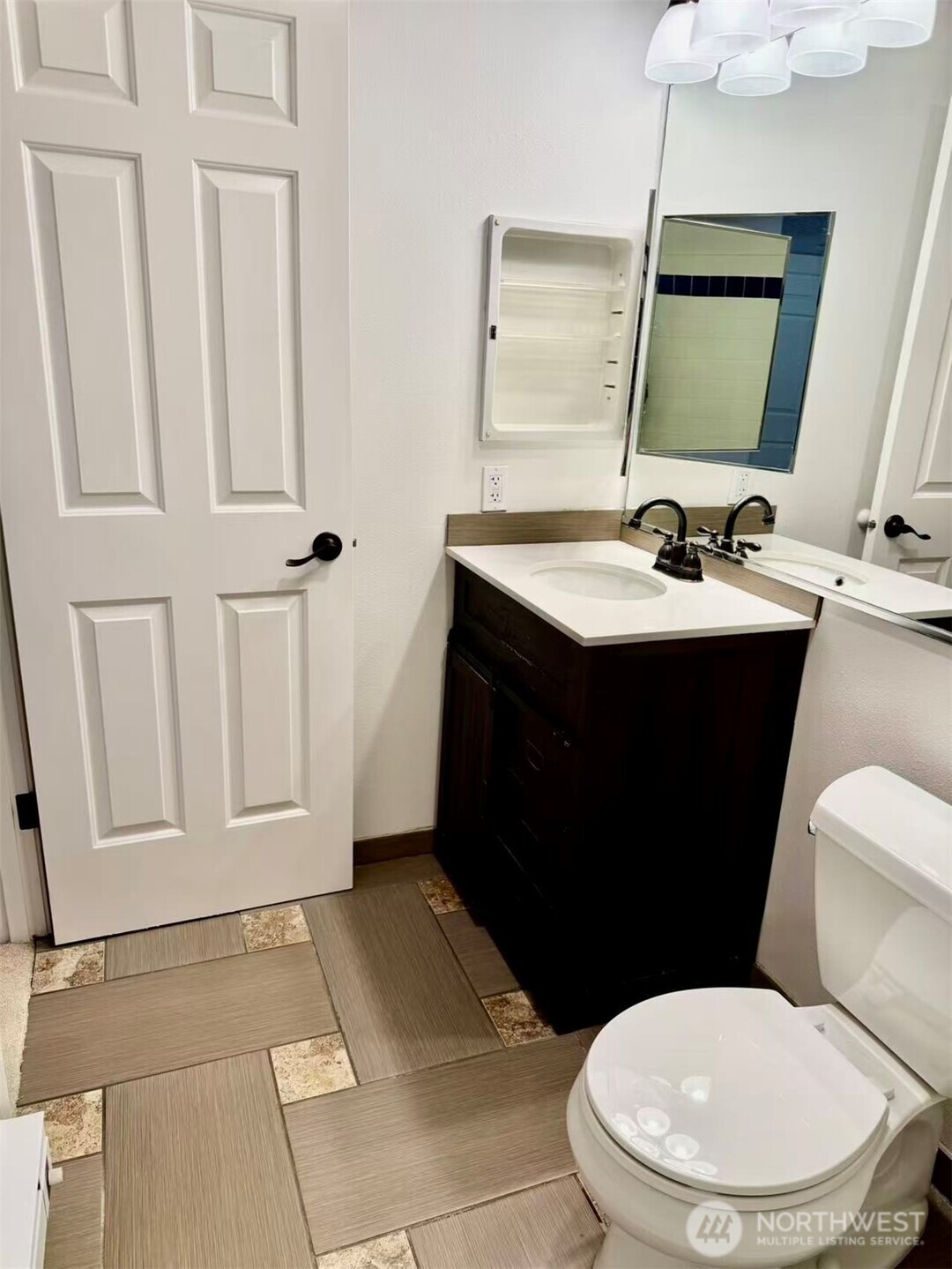 927 132nd Street Southwest, Unit D3 Everett, WA 98204 - Photo 17 of 20 a bathroom with a sink and a mirror