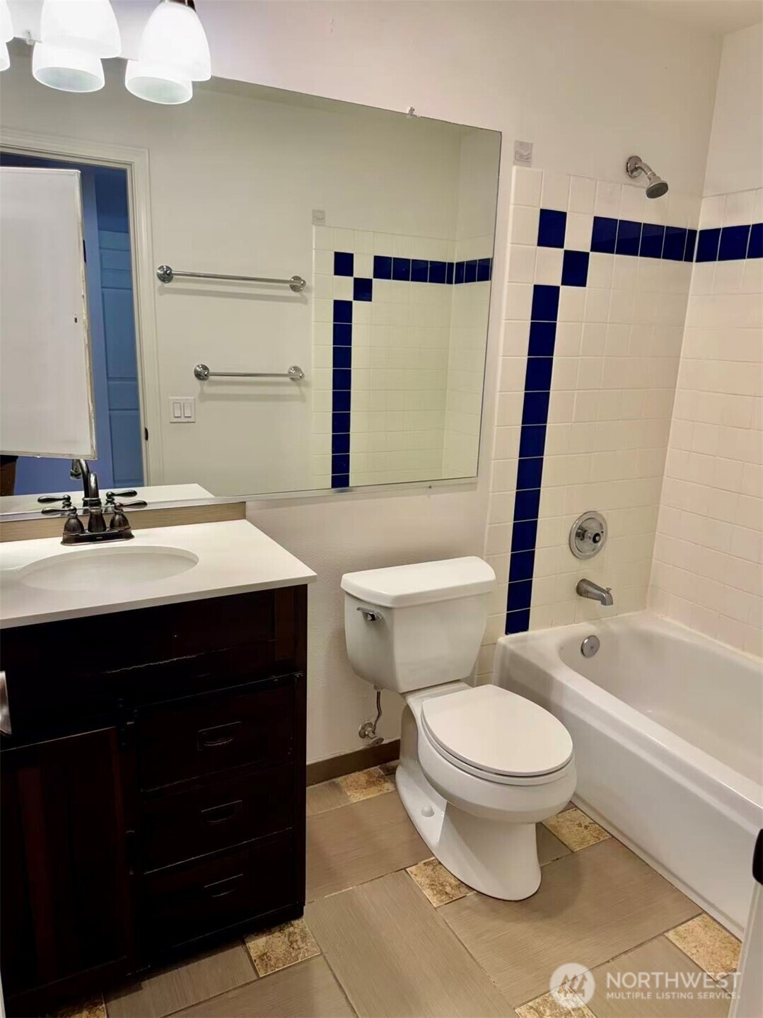 927 132nd Street Southwest, Unit D3 Everett, WA 98204 - Photo 18 of 20 a bathroom with a sink toilet a mirror and shower
