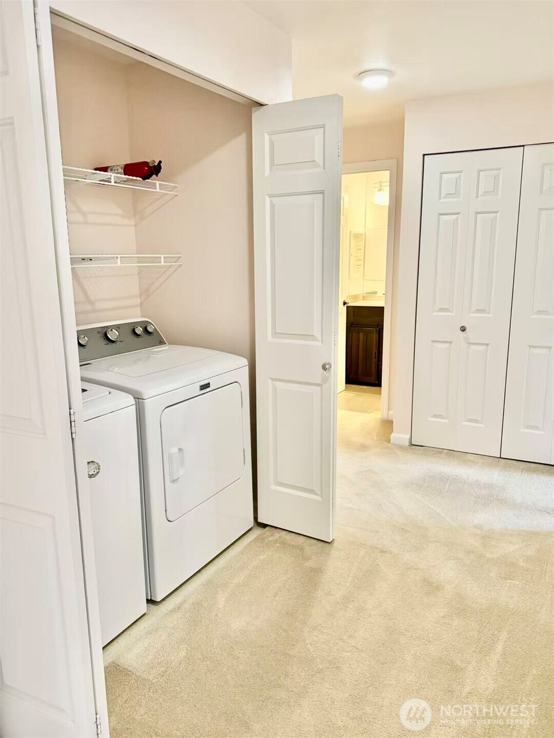 927 132nd Street Southwest, Unit D3 Everett, WA 98204 - Photo 19 of 20 a view of a kitchen with white cabinets and white appliances