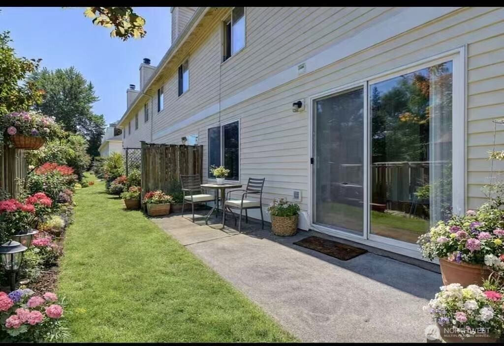 927 132nd Street Southwest, Unit D3 Everett, WA 98204 - Photo 20 of 20 a view of a backyard with garden and flowers