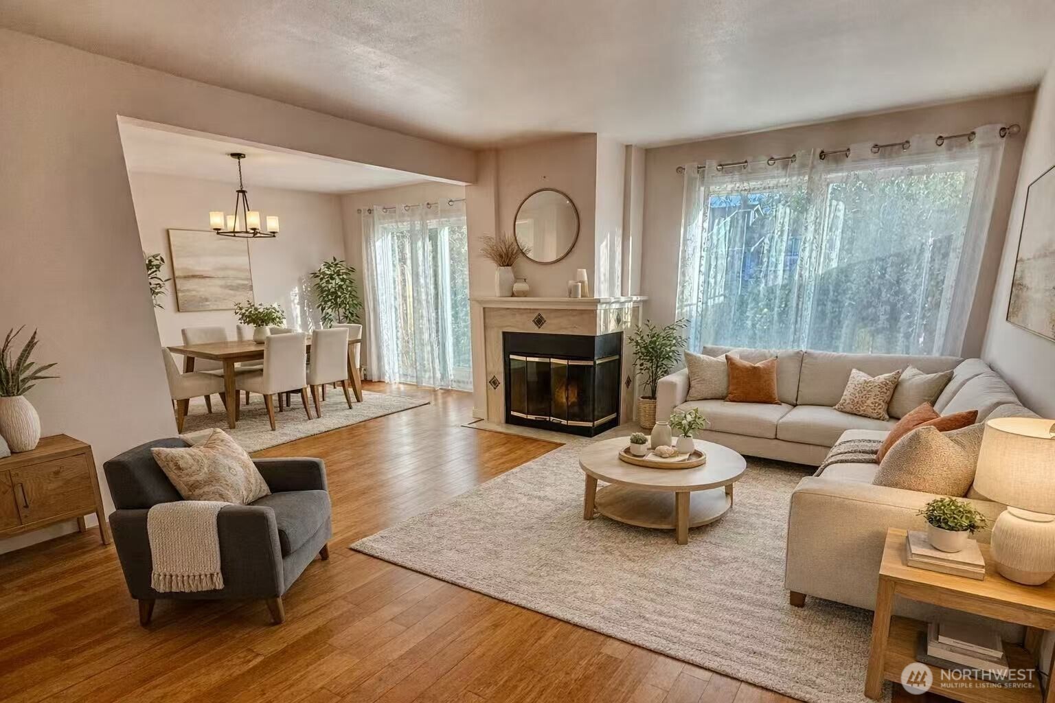 927 132nd Street Southwest, Unit D3 Everett, WA 98204 - Photo 2 of 20 a living room with furniture a fireplace a rug and a large window