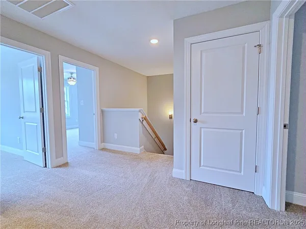 a bathroom with a granite countertop sink a toilet a mirror and shower