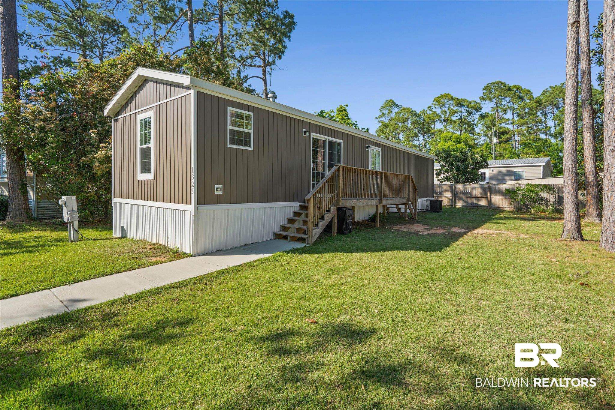 1325 Ridgewood Drive Lillian, AL 36549 - Photo 1 of 32 Manufactured / mobile home with a wooden deck