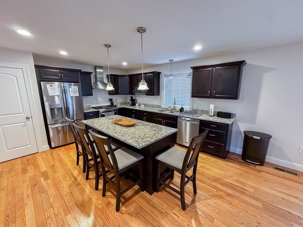 23 Ralph Street Chicopee, MA 01020 - Photo 6 of 42 a view of a dining room with furniture