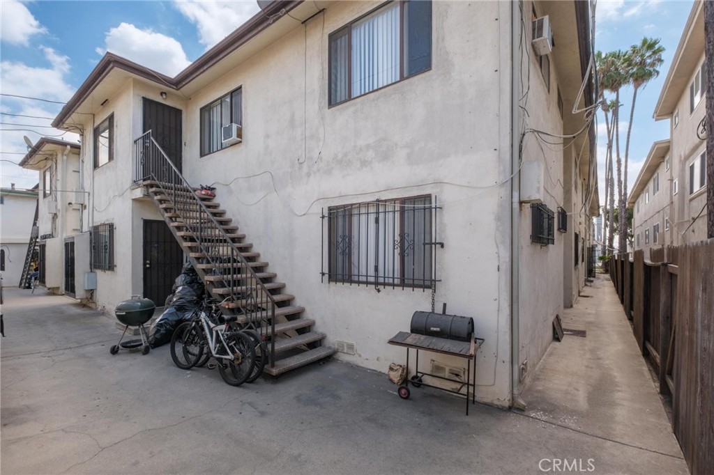 625 East 99th Street Inglewood, CA 90301 - Photo 11 of 50 a view of a chairs with a small yard and wooden fence