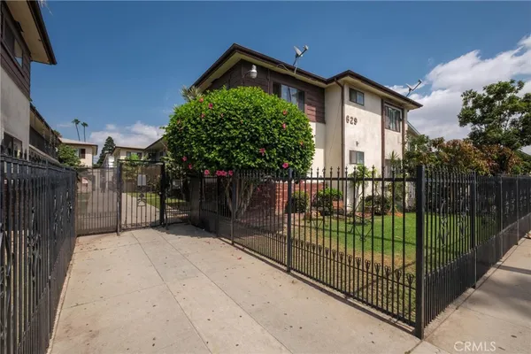 a view of a gate and fence