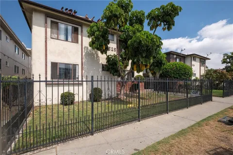 a view of a gate and fence