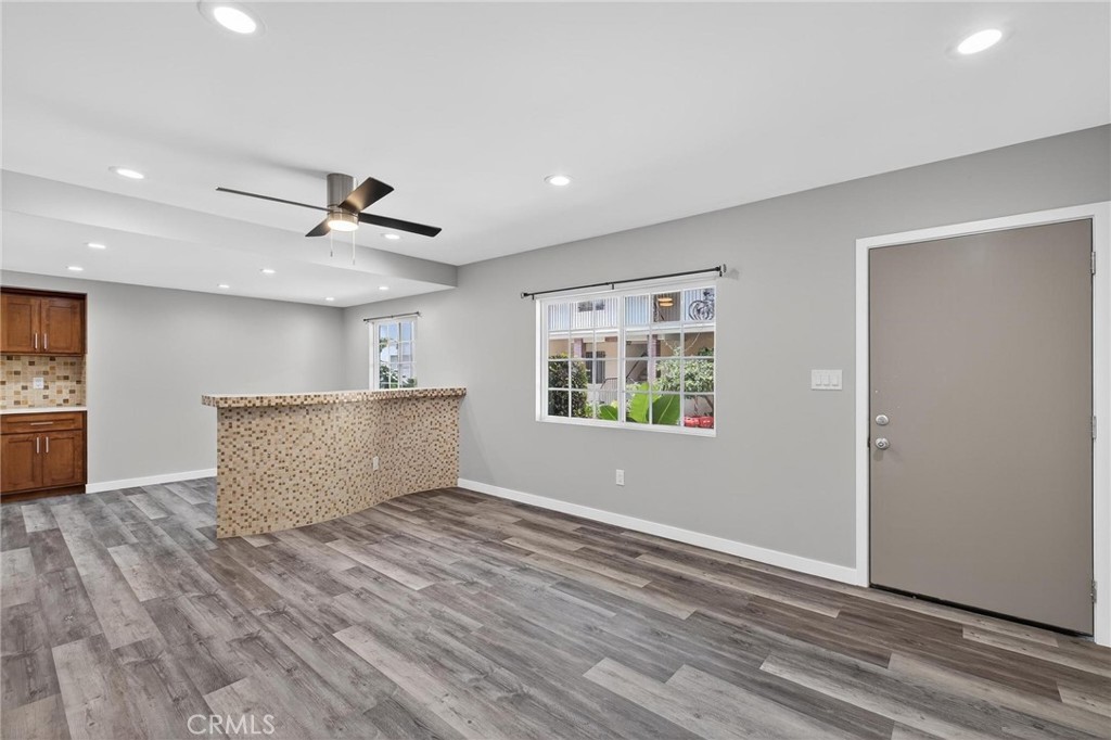 625 East 99th Street Inglewood, CA 90301 - Photo 22 of 50 a view of kitchen with wooden floor and window