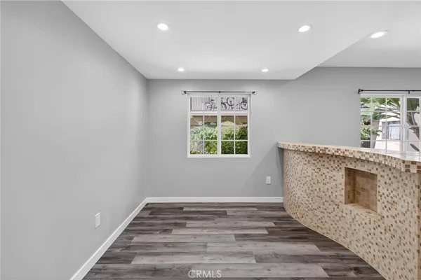 a bathroom with a sink a mirror and a shower