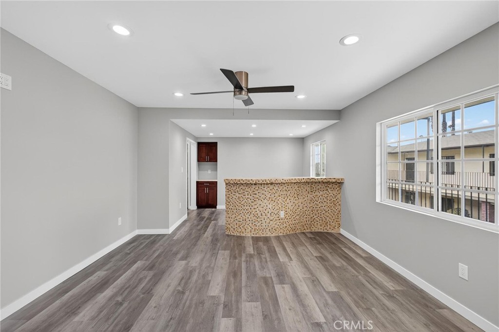 625 East 99th Street Inglewood, CA 90301 - Photo 42 of 50 a view of workspace with wooden floor and windows
