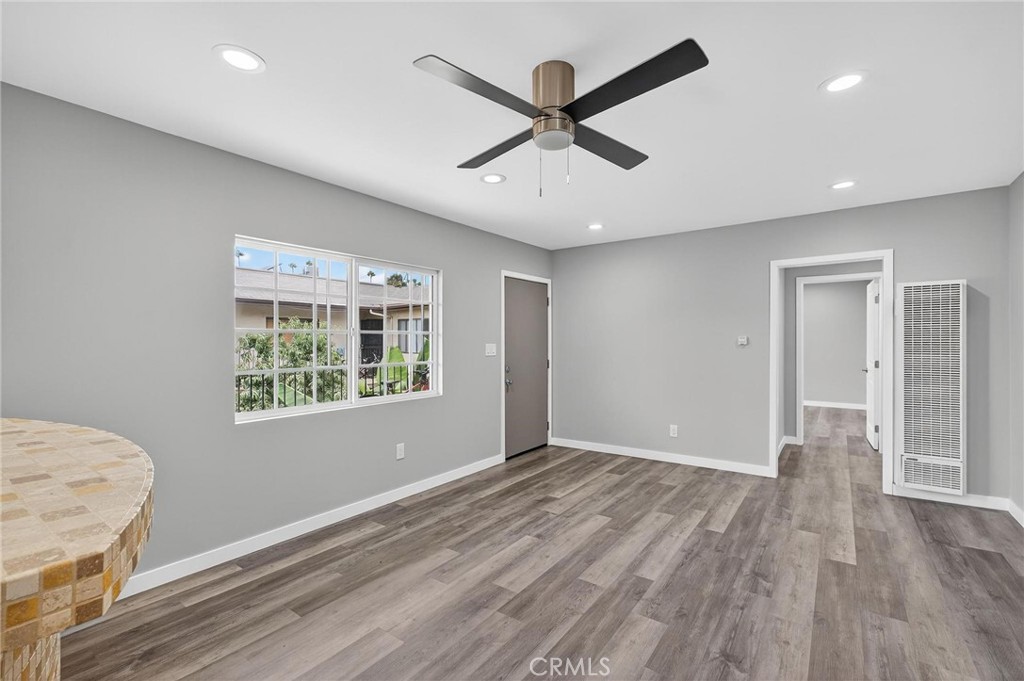 625 East 99th Street Inglewood, CA 90301 - Photo 44 of 50 a view of an empty room with wooden floor and a window