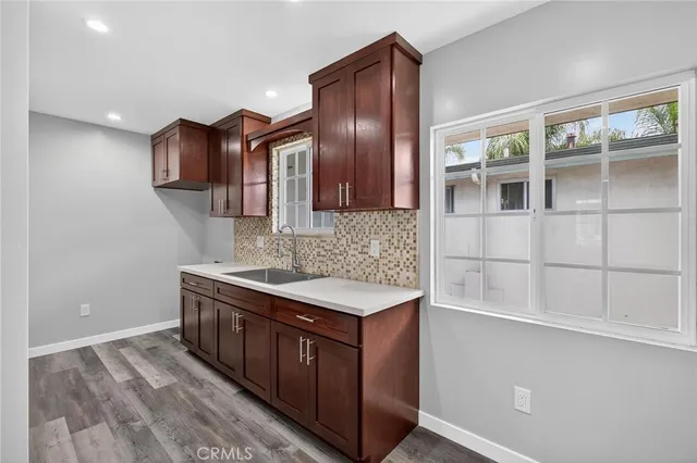 a view of a bedroom with a bed and glass door