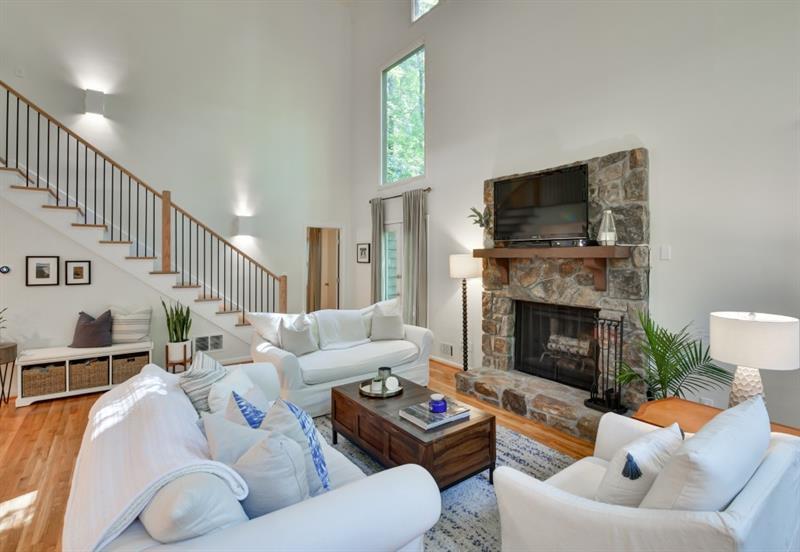 7169 Riverside Drive Atlanta, GA 30328 - Photo 1 of 1 Welcome to 7169 Riverside Drive! Cozy up around the fireplace in this spacious two story great room and enjoy the open concept living/dining/kitchen area.