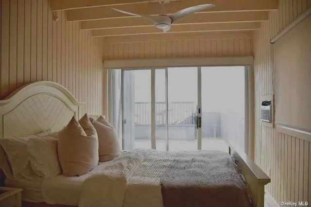 a room with a couch and a rug