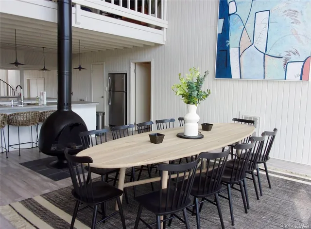 a dining room with furniture and wooden floor