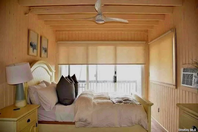 a view of walk in closet with window and couch