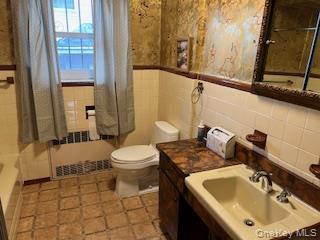 4824 Beverley Road Brooklyn, NY 11203 - Photo 14 of 18 a bathroom with a sink a toilet and shower