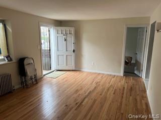 4824 Beverley Road Brooklyn, NY 11203 - Photo 2 of 18 an empty room with wooden floor and furniture