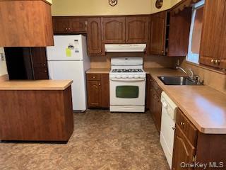 4824 Beverley Road Brooklyn, NY 11203 - Photo 3 of 18 a kitchen with a stove and a refrigerator