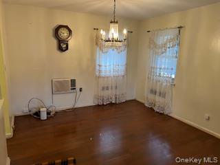 4824 Beverley Road Brooklyn, NY 11203 - Photo 4 of 18 a view of an empty room with wooden floor and a window