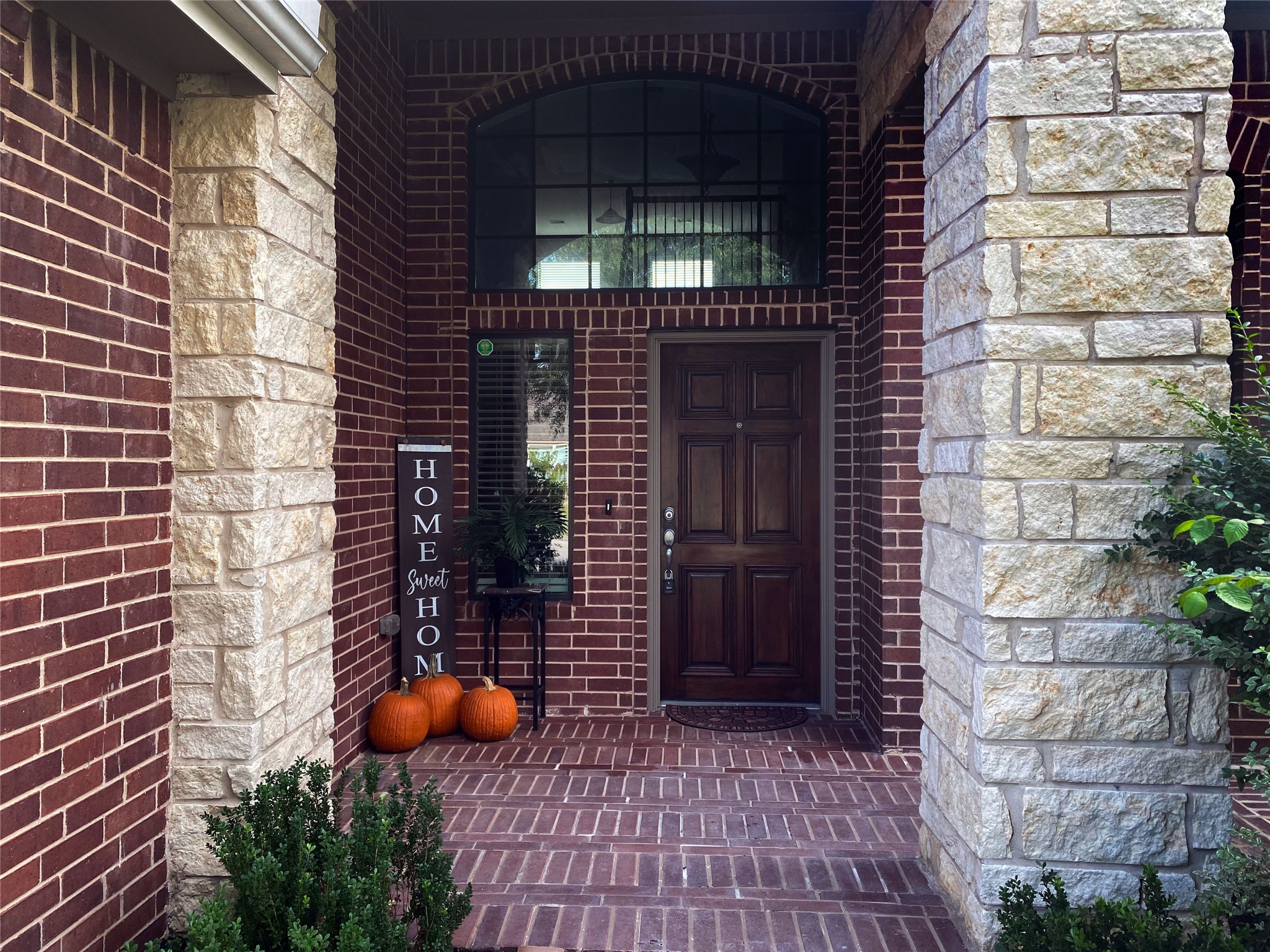 Beautiful home with stone and brick elevation and two-story front porch